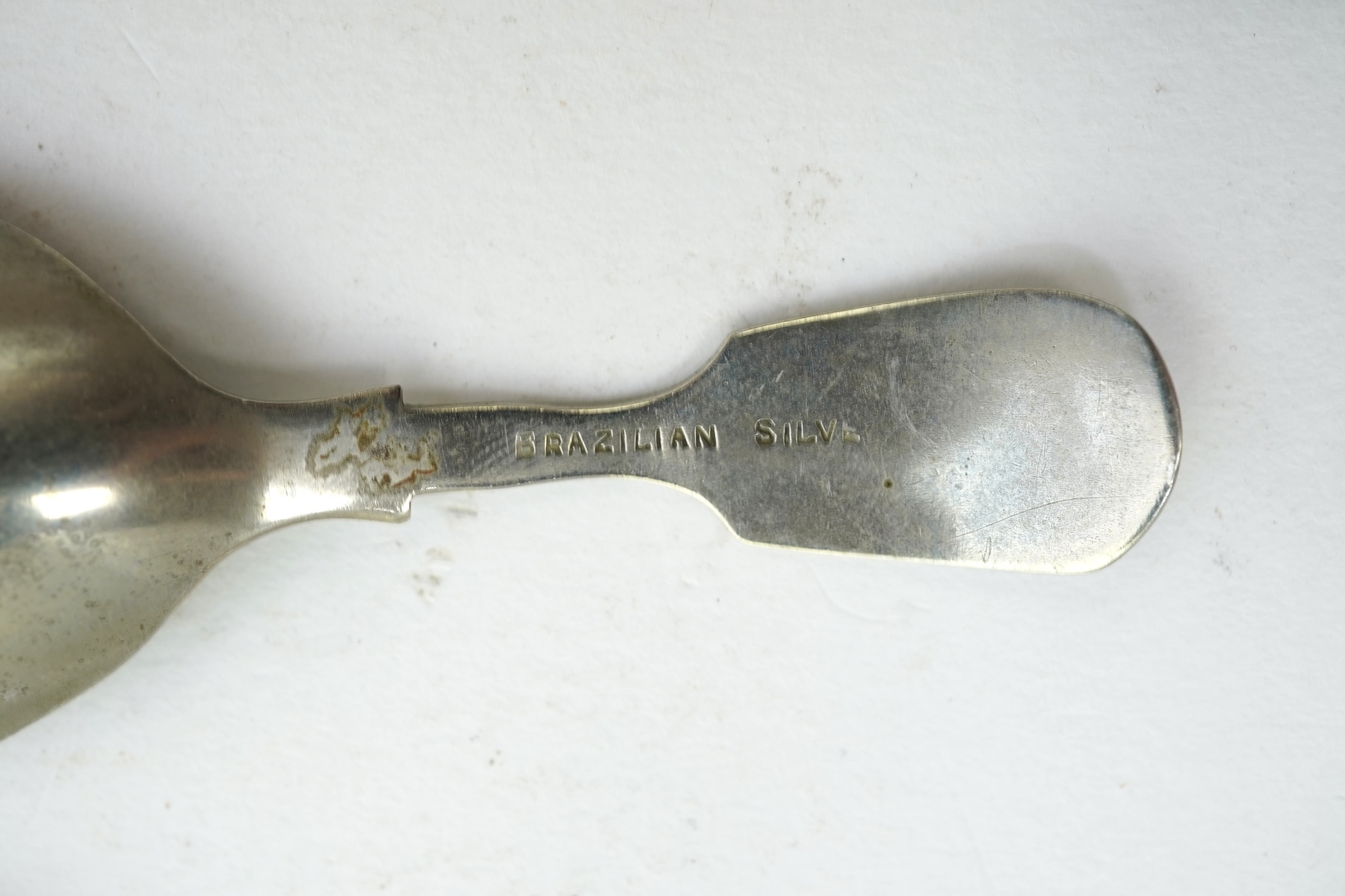 A collection of ten assorted mainly 19th century silver and white metal fiddle pattern caddy spoons